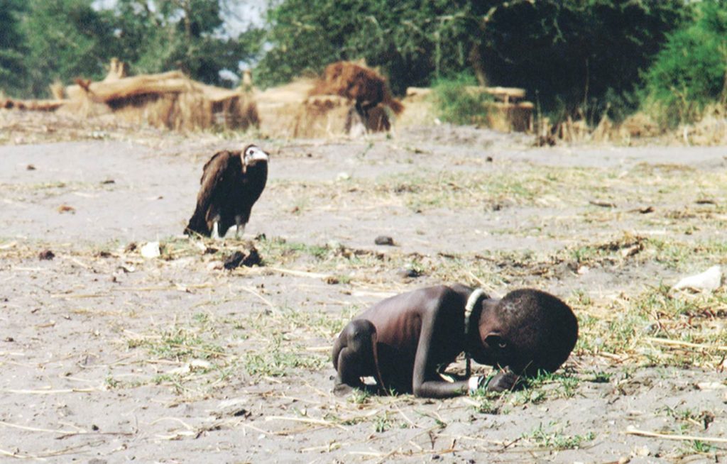 vulture and a girl in sudan