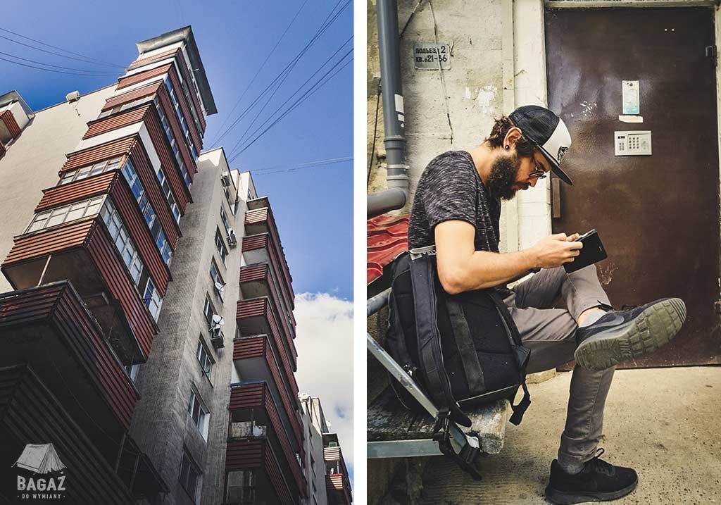 blok mieszkalny i mężczyzna z brodą siedzący na ławce